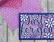 Decorative sign with flowers and 'Just for you' text on a wooden surface