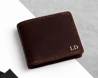 Brown leather wallet with initials 'LD' on a light gray background